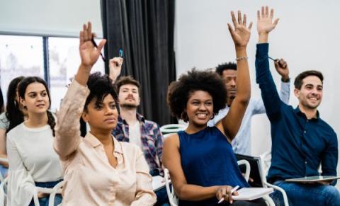 picture of a group of people sitting in a conference together