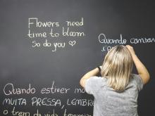 picture of a child writing on a chalkboard