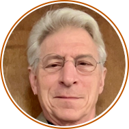 headshot with circular orange background of hamish blackman