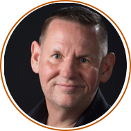 headshot with circular orange background oftim carlson