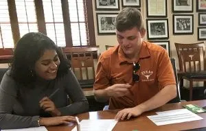 picture of two students working at a table