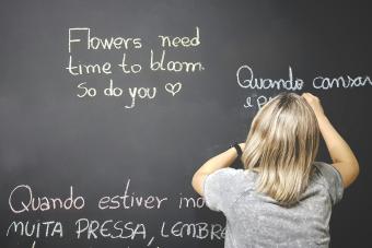 picture of a child writing on a chalkboard