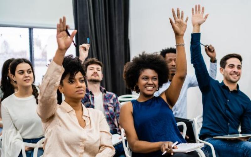 picture of a group of people sitting in a conference together